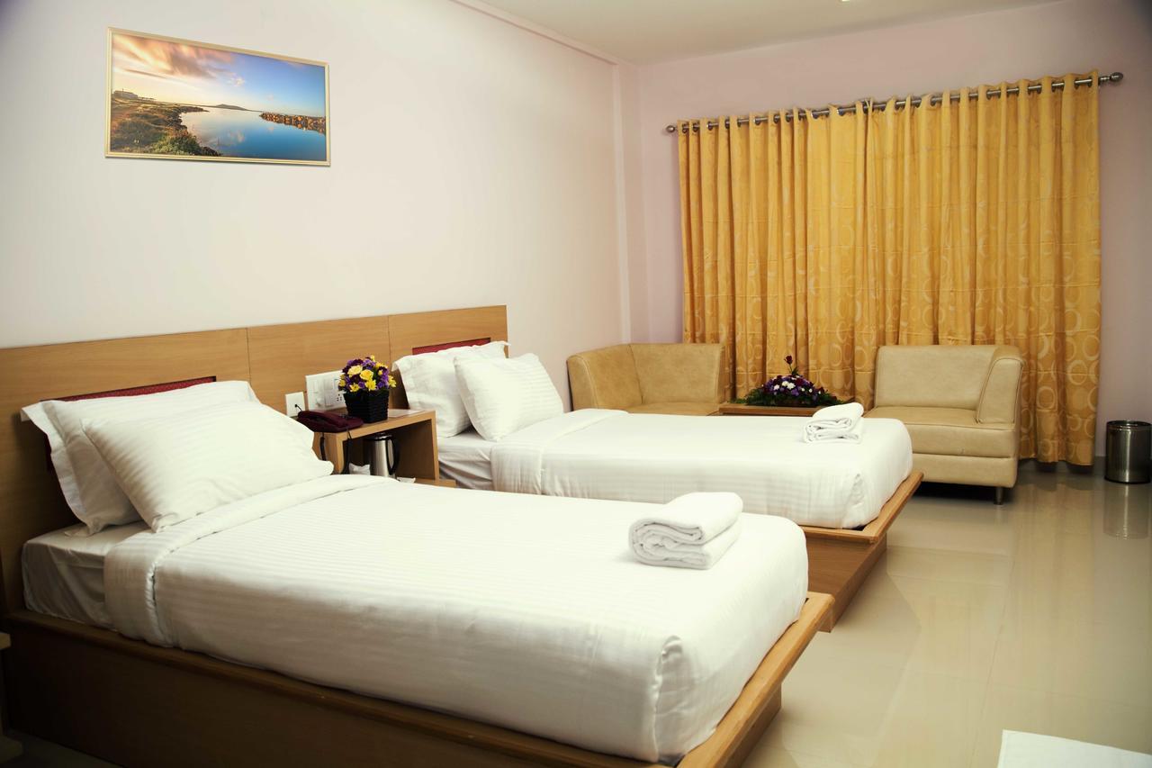 Hotel Rainbow Suites Kannúr Kültér fotó